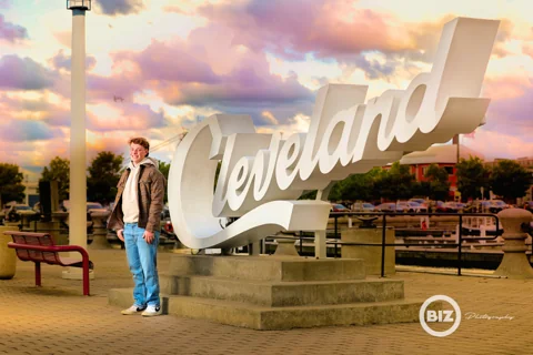 Senior portrait at the Cleveland sign at North Coast Harbor, photographed by BIZ Photography