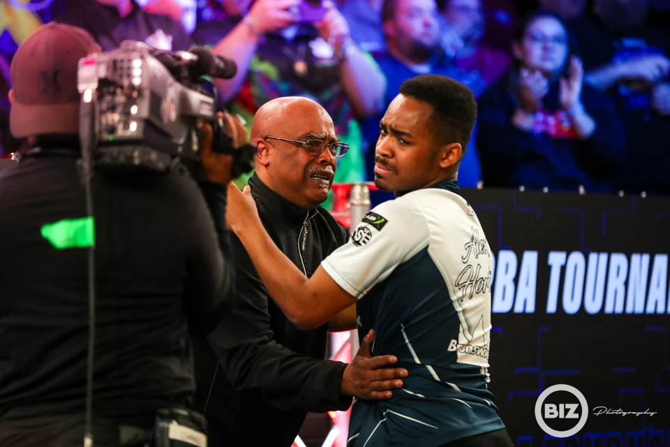An emotional embrace beside a television camera at the PBA Tournament of Champions