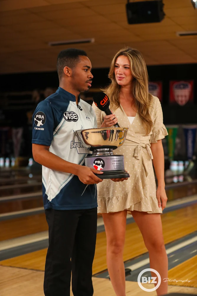 Tournament winner and presenter with the Tournament of Champions trophy