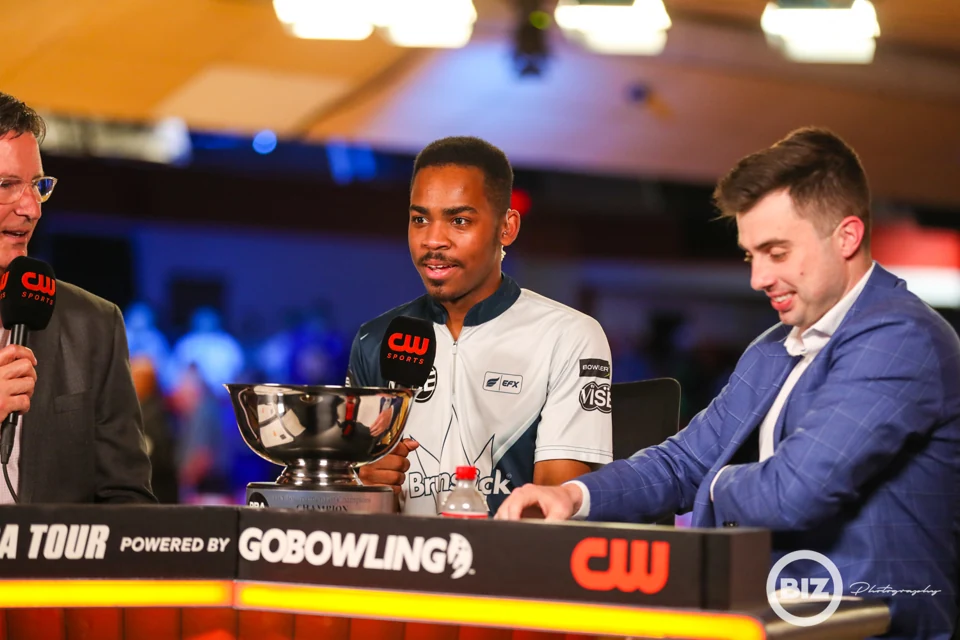 Tournament winner interviewed beside the trophy at the PBA Tournament of Champions