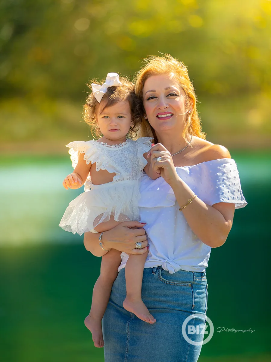 Mother and daughter photographed outdoors